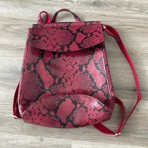 Red and black snakeskin backpack never been used.